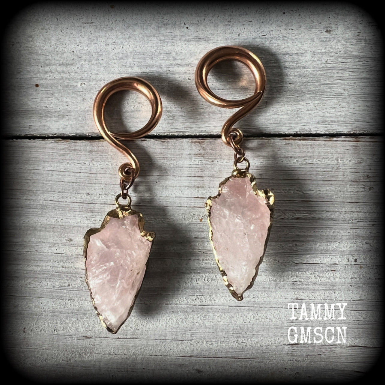 These earrings feature gorgeous baby pink arrowhead gemstones, measuring just over 6.5cms from tip to tip, and weighing approx 8 grams each, nice and dangly and not too heavy.

These earrings have been made on 6 gauge (4mm) surgical steel full curls, to be worn in stretched lobes.