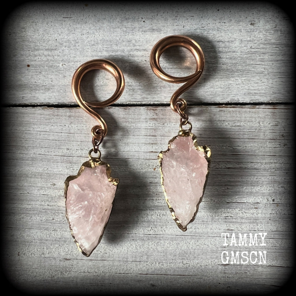 These earrings feature gorgeous baby pink arrowhead gemstones, measuring just over 6.5cms from tip to tip, and weighing approx 8 grams each, nice and dangly and not too heavy.

These earrings have been made on 6 gauge (4mm) surgical steel full curls, to be worn in stretched lobes.