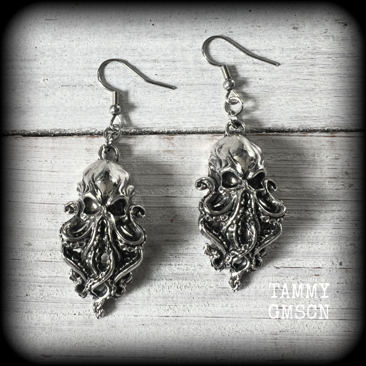 Featuring antique silver elder god Chuthulu charms, these earrings weigh approx 8 grams each, and are nice and dangly, measuring just over 6cmd from tip to tip.

This pair have been made with stainless steel french hooks, suitable for pierced ears.