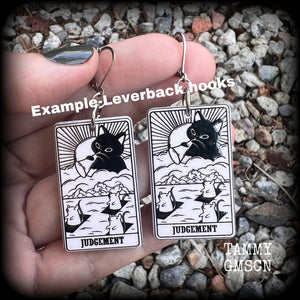 These adorable 'Judgement' tarot card earrings feature a lightweight tarot card charm, weighing only a few grams each, and measure approx 5cms from tip to tip.
This pair has been made with stainless steel leverbacks, for pierced ears.