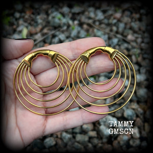 These gorgeous gold hoop gauged earrings feature beautiul titanium coated surgical steel stacked hoops, measuring just under 6cms from tip to tip, and weighing approx 13 grams each.

These are suitable to be worn in stretched lobes from 4 gauge (5mm), and will fit in earlets and tunnels in stretched lobes from 2 gauge (6mm).
