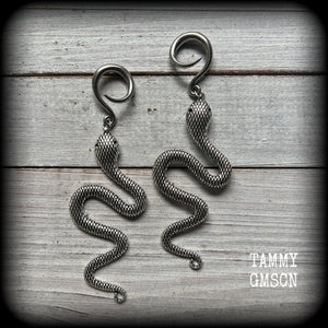 These awesome gauged earrings feature an antique silver snake, nice and dangly measuring just on 10cms from tip to tip, and weighing approx 14 grams each.
This pair has been made on 6 gauge (4mm) surgical steel full curl hooks, suitable for stretched lobes.