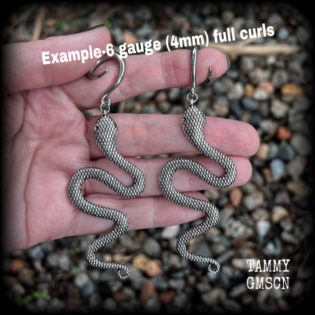 These awesome gauged earrings feature an antique silver snake, nice and dangly measuring just on 10cms from tip to tip, and weighing approx 14 grams each.
This pair has been made on 6 gauge (4mm) surgical steel full curl hooks, suitable for stretched lobes.