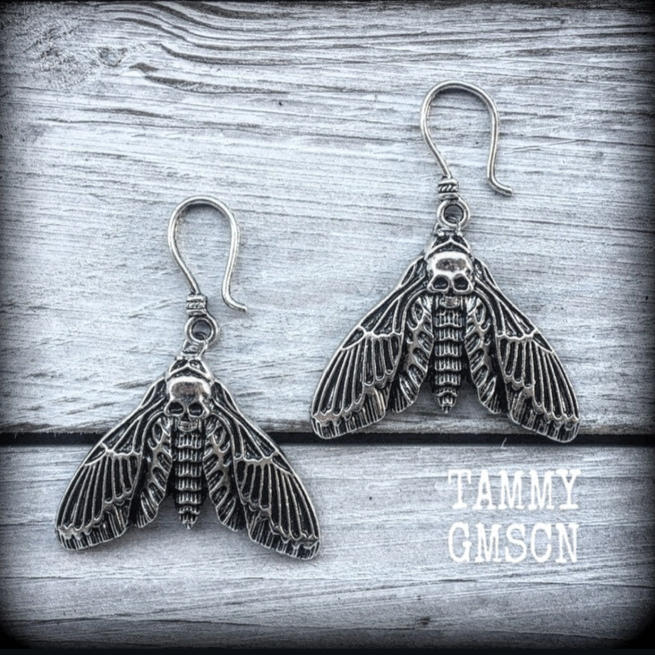 These gorgeous earrings feather antique silver deathshead moths, measuring just under 7cms, and weighing in at approx 7 grams each.
This pair has been made on small antique silver shephard hooks, suitable to be worn in stretched lobes with silicone earlets from 8 gauge (3mm).
