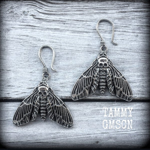 These gorgeous earrings feather antique silver deathshead moths, measuring just under 7cms, and weighing in at approx 7 grams each.
This pair has been made on small antique silver shephard hooks, suitable to be worn in stretched lobes with silicone earlets from 8 gauge (3mm).
