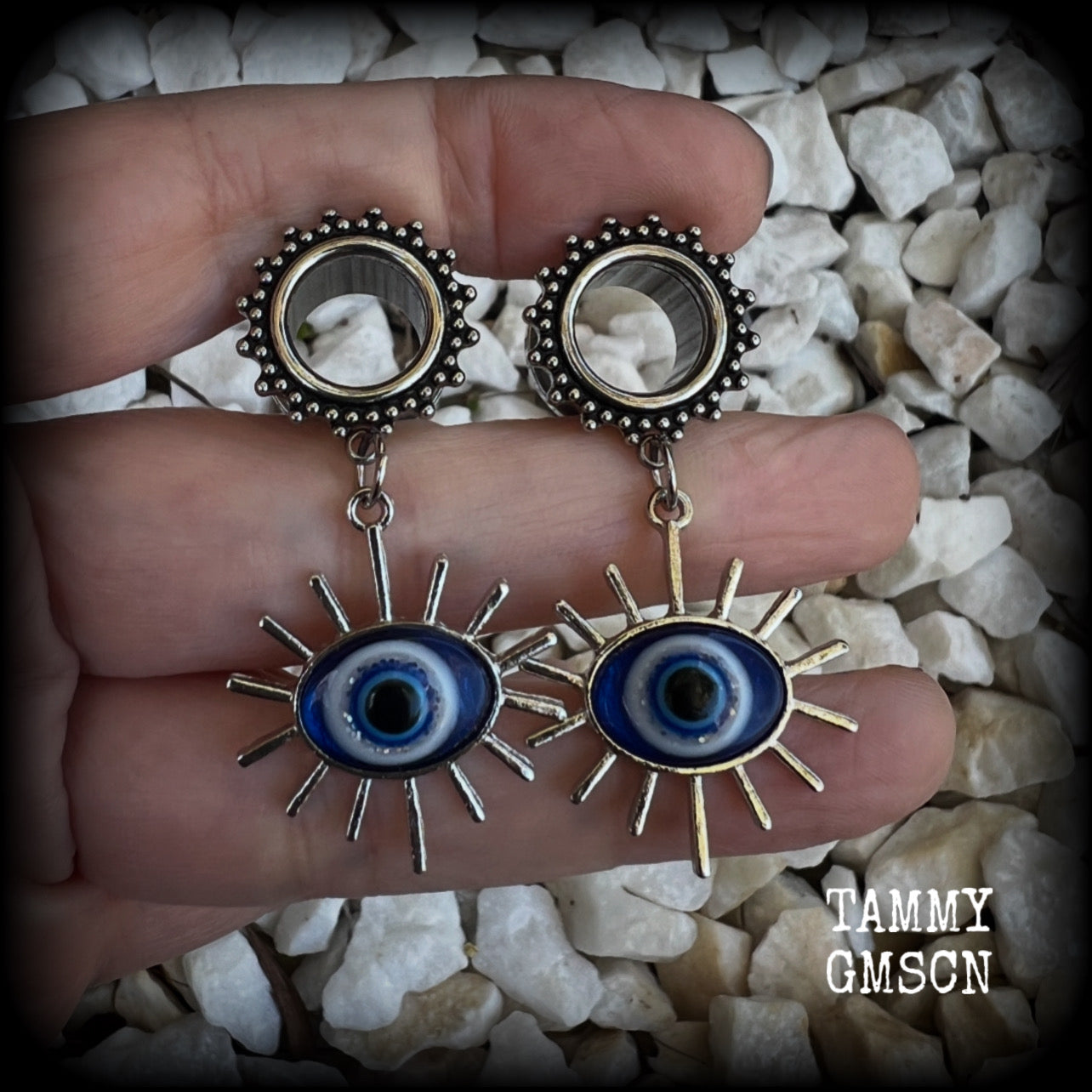 These stunning tunnel earrings feature gorgeous blue and white enamel and antique silver turkish evil eye charms, are nice and lightweight, weighing approx 10 grams each, measuring approx 6cms from tip to tip.

This pair has been made on 1/2” (12mm) gauge ornate surgical steel screw fit tunnels.