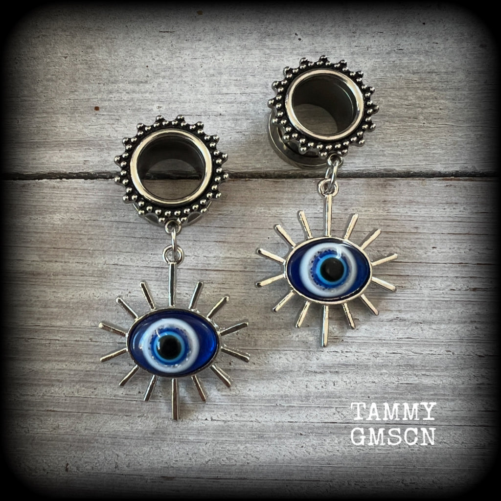 These stunning tunnel earrings feature gorgeous blue and white enamel and antique silver turkish evil eye charms, are nice and lightweight, weighing approx 10 grams each, measuring approx 6cms from tip to tip.

This pair has been made on 1/2” (12mm) gauge ornate surgical steel screw fit tunnels.