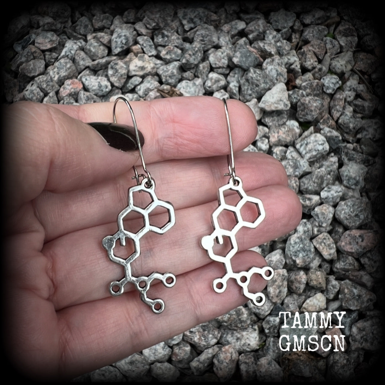 These awesome earrings feature cute little antique silver LSD molecules, measuring just over 6.5cms from tip to tip, and are nice and light weight at only a few grams each.

This pair have been made on antique silver kidney hooks, to be worn in pierced ears or stretched lobes.