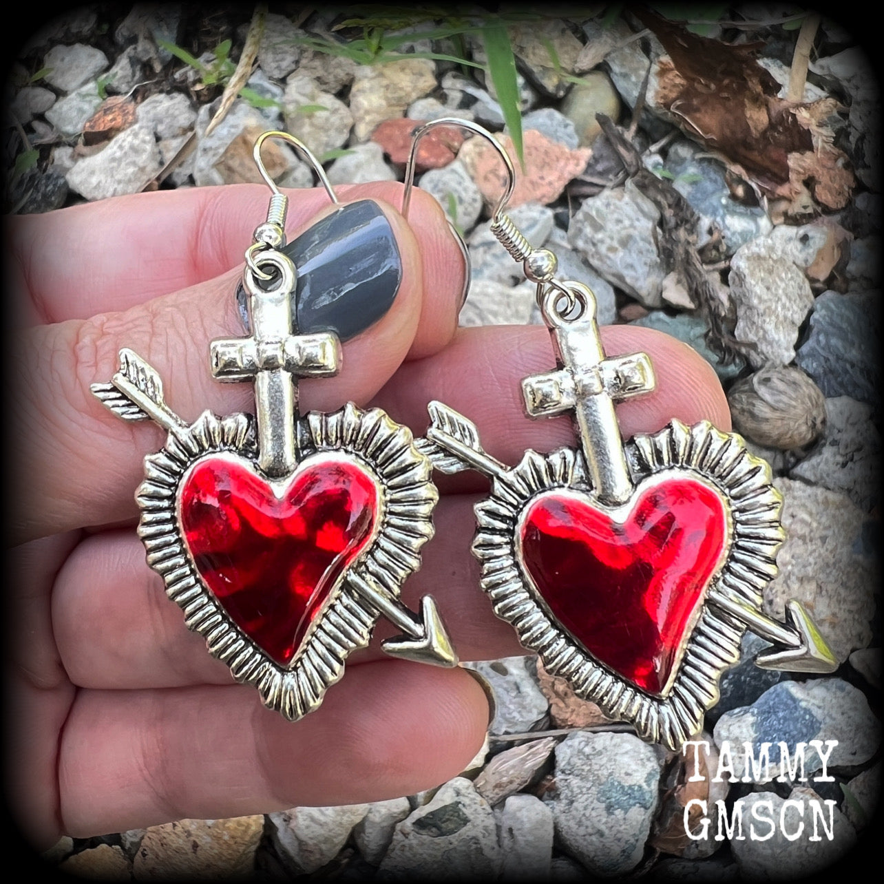 These beautiful red enamel and antique silver heart earrings are nice and lightweight at approx 5 grams a piece, and not too dangly, measuring just over 5cms from tip to tip.
This pair has been made on stainless steel french hooks to be worn through pierced ears.