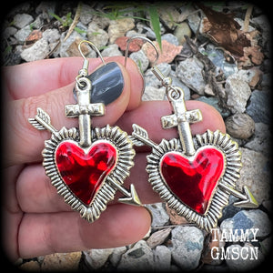 These beautiful red enamel and antique silver heart earrings are nice and lightweight at approx 5 grams a piece, and not too dangly, measuring just over 5cms from tip to tip.
This pair has been made on stainless steel french hooks to be worn through pierced ears.