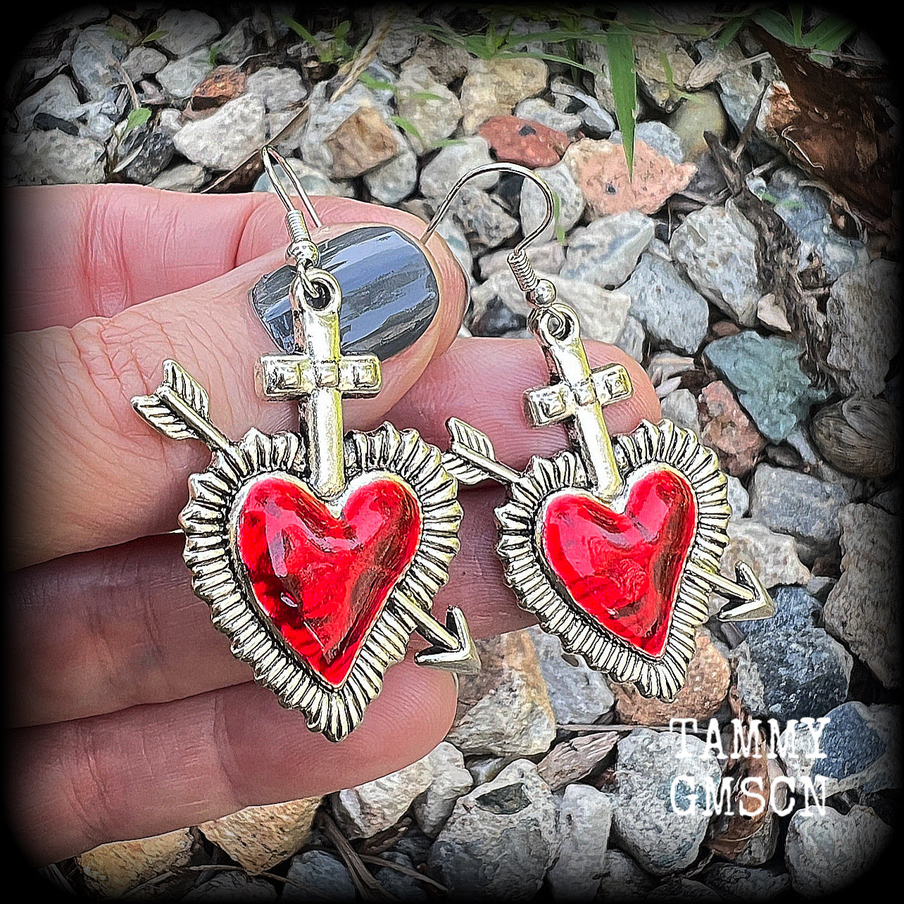 These beautiful red enamel and antique silver heart earrings are nice and lightweight at approx 5 grams a piece, and not too dangly, measuring just over 5cms from tip to tip.
This pair has been made on stainless steel french hooks to be worn through pierced ears.