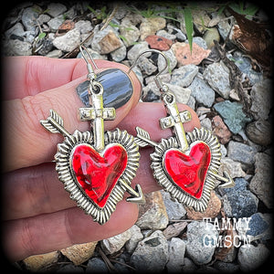 These beautiful red enamel and antique silver heart earrings are nice and lightweight at approx 5 grams a piece, and not too dangly, measuring just over 5cms from tip to tip.
This pair has been made on stainless steel french hooks to be worn through pierced ears.
