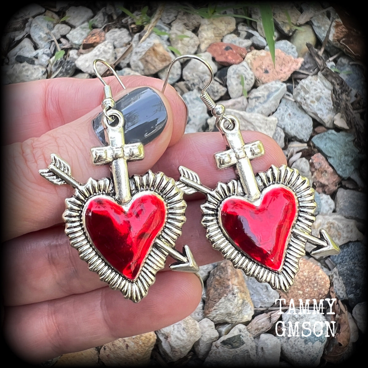 These beautiful red enamel and antique silver heart earrings are nice and lightweight at approx 5 grams a piece, and not too dangly, measuring just over 5cms from tip to tip.
This pair has been made on stainless steel french hooks to be worn through pierced ears.