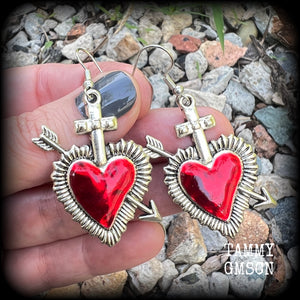 These beautiful red enamel and antique silver heart earrings are nice and lightweight at approx 5 grams a piece, and not too dangly, measuring just over 5cms from tip to tip.
This pair has been made on stainless steel french hooks to be worn through pierced ears.