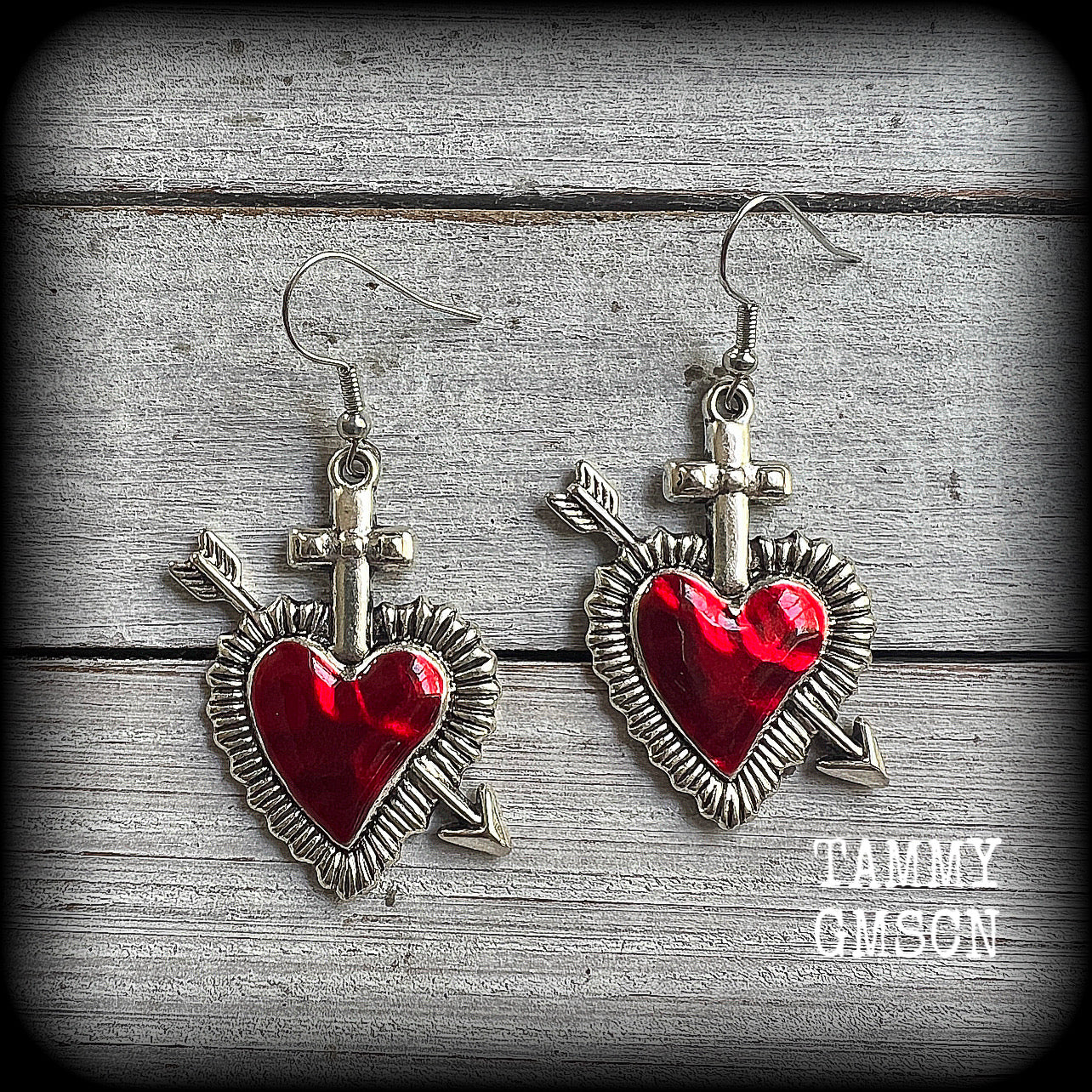These beautiful red enamel and antique silver heart earrings are nice and lightweight at approx 5 grams a piece, and not too dangly, measuring just over 5cms from tip to tip.
This pair has been made on stainless steel french hooks to be worn through pierced ears.