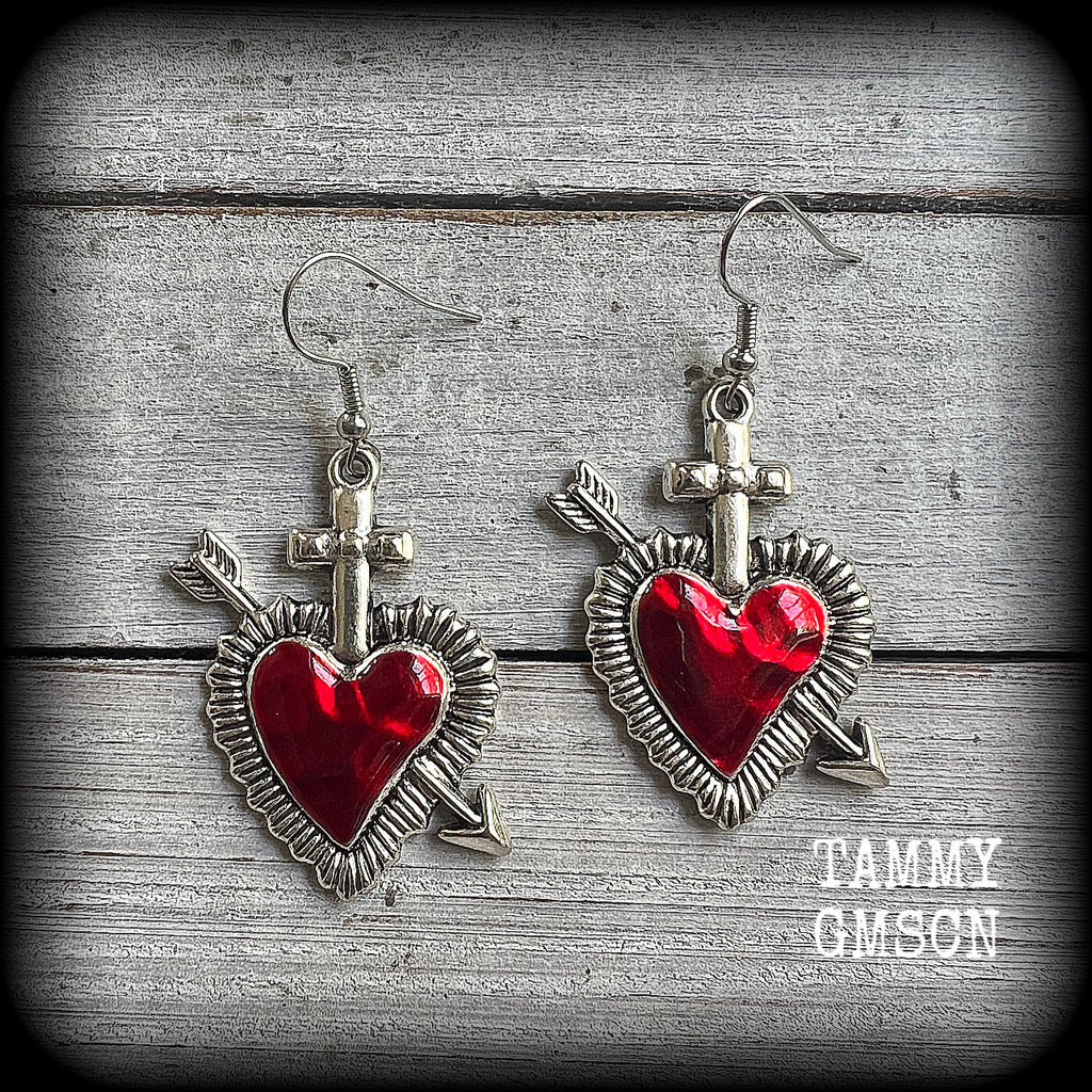 These beautiful red enamel and antique silver heart earrings are nice and lightweight at approx 5 grams a piece, and not too dangly, measuring just over 5cms from tip to tip.
This pair has been made on stainless steel french hooks to be worn through pierced ears.