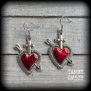 These beautiful red enamel and antique silver heart earrings are nice and lightweight at approx 5 grams a piece, and not too dangly, measuring just over 5cms from tip to tip.
This pair has been made on stainless steel french hooks to be worn through pierced ears.