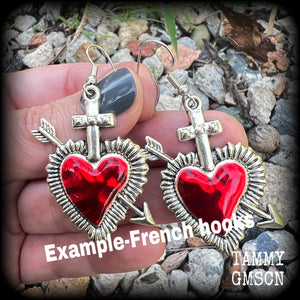 These beautiful red enamel and antique silver heart earrings are nice and lightweight at approx 5 grams a piece, and not too dangly, measuring just over 5cms from tip to tip.
This pair has been made on stainless steel french hooks to be worn through pierced ears.