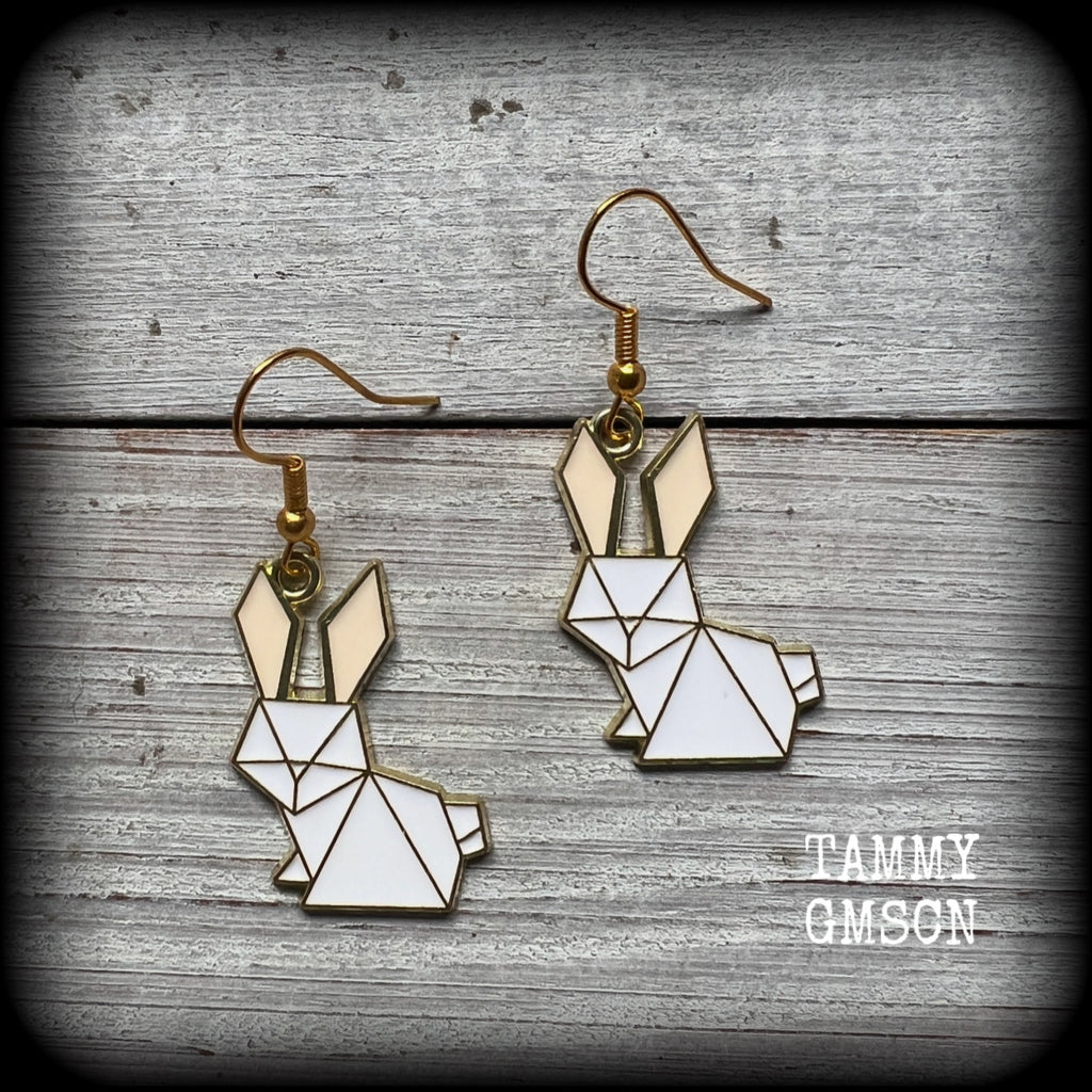 Super cute and super light weight, these adorable earrings feature white enamel and antique gold origami white rabbit charms.

Measuring approx 4cm from tip to tip and weighing only a gram or two each, this pair has been made with french hooks-for pierced ears.