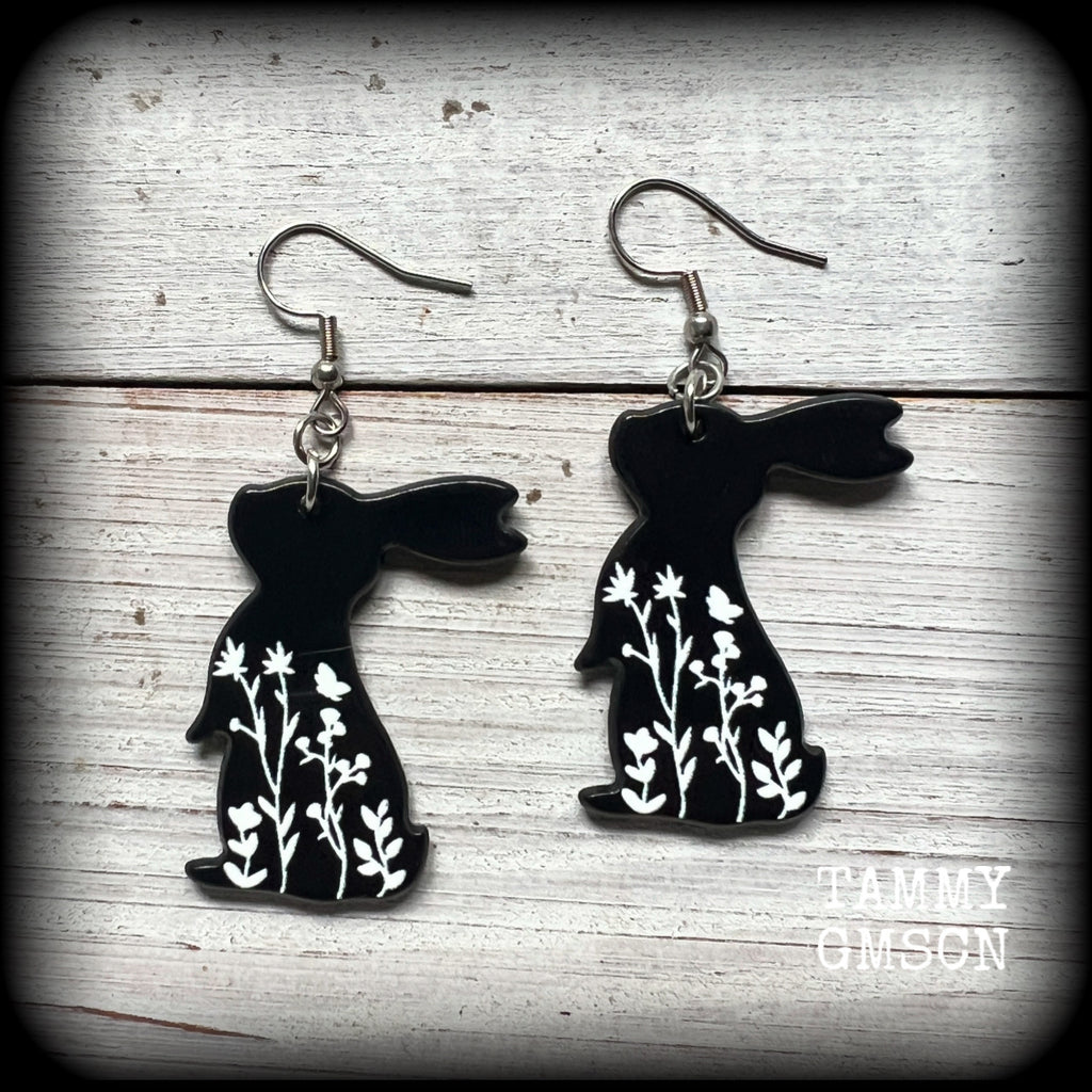 Featuring a black rabbit silhouette looking skyward with white floral sprig, these earrings are nice and lightweight, weighing only a few grams each and measure approx 6 from tip to tip.
This pair has made on stainless steel french hooks, suitable for pierced ears.