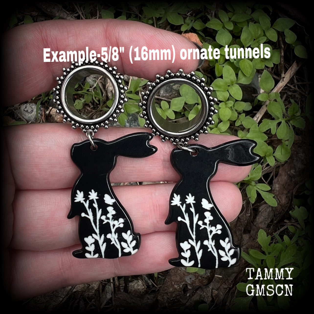 Featuring a black rabbit silhouette looking skyward with white floral sprig, these earrings weigh only 8 grams each and measure approx 6 from tip to tip. This pair has been made on 5/8” gauge (16mm) ornate surgical steel screw fit tunnels.