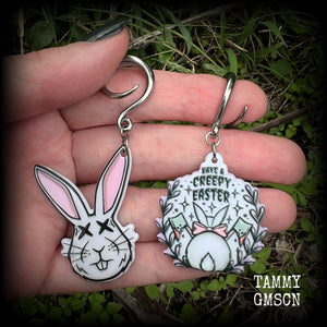 Featuring super cute, slightly creepy zombie rabbit acrylic charms, these earrings weigh approx 5 grams each, and are lovely and dangly at approx 6.5cms from tip to tip. This pair has been made on 6 gauge (4mm) surgical steel full curl hooks.