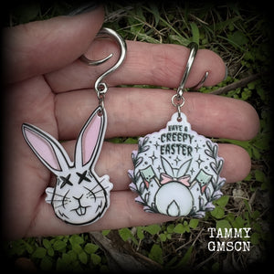 Featuring super cute, slightly creepy zombie rabbit acrylic charms, these earrings weigh approx 5 grams each, and are lovely and dangly at approx 6.5cms from tip to tip. This pair has been made on 6 gauge (4mm) surgical steel full curl hooks.