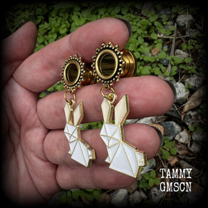 These earrings feature a pair of antique gold and white enamel origami rabbits, are nice and lightweight at only 6 grams each and measure approx 5cms from tip to tip. This pair has been made on 00 gauge (10mm) ornate surgical steel screw fit tunnels