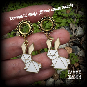 These earrings feature a pair of antique gold and white enamel origami rabbits, are nice and lightweight at only 6 grams each and measure approx 5cms from tip to tip. This pair has been made on 00 gauge (10mm) ornate surgical steel screw fit tunnels