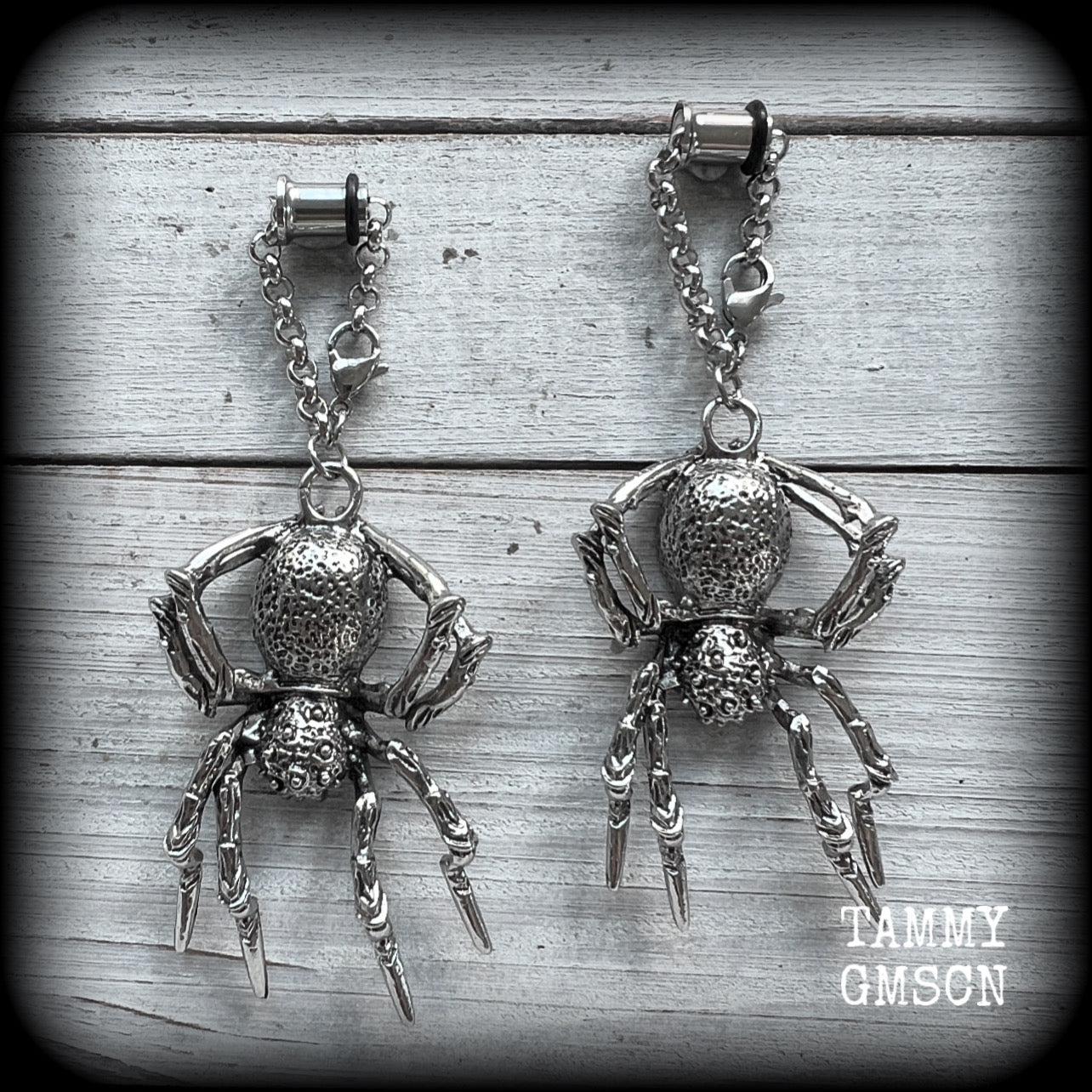 These big beautiful antique silver spider tunnel dangles are not too heavy and nice and dangly, weighing approx 18 grams each, and measuring just on 9cms from tip to tip.

🕷️ PLEASE NOTE-This particular chain will not filter through tunnels smaller than 2 gauge (6mm), though I have lots of different chains that will. Get in touch and we can pick something just for you x

💥This listing includes one pair of surgical steel single flared O-ring earlets.
