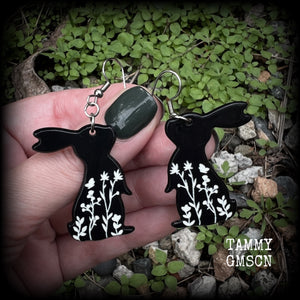Featuring a black rabbit silhouette looking skyward with white floral sprig, these earrings are nice and lightweight, weighing only a few grams each and measure approx 6 from tip to tip. This pair has made on stainless steel french hooks.