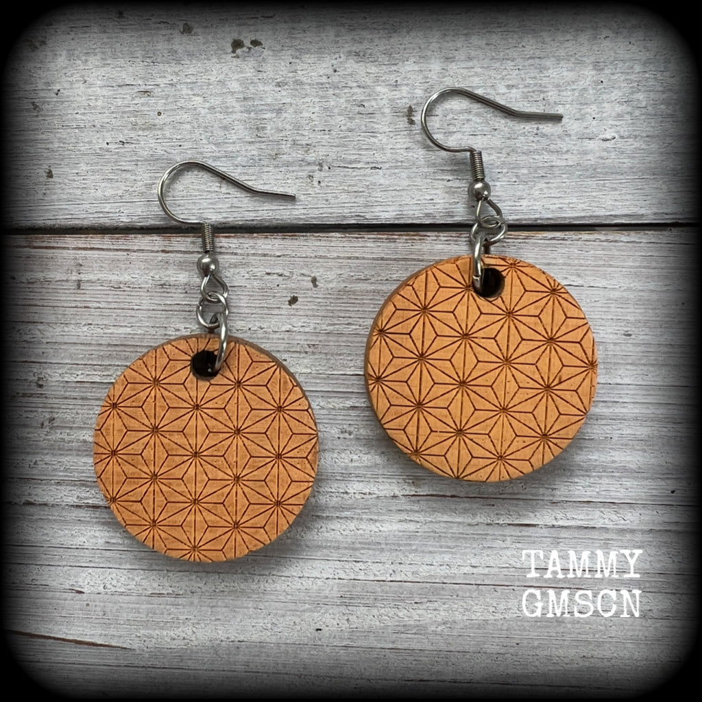 These beautiful wood earrings feature a gorgeous traditional Japanese asanoha geometric pattern, are nice and dangly measuring just on 5.5cms from tip to tip, and weigh only a few grams each.

This pair has been made with stainless steel french hooks- for pierced ears.