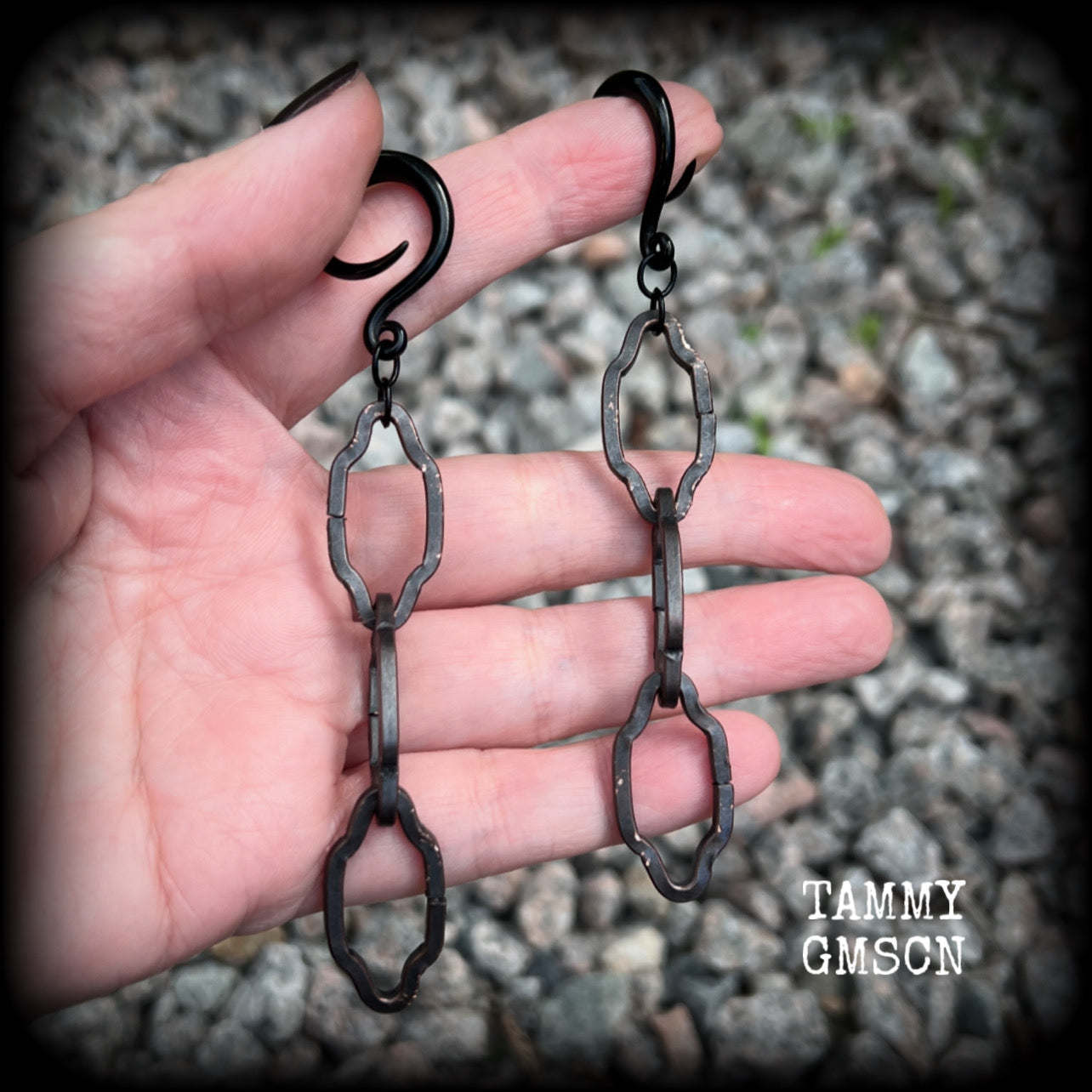 These gorgeous gothic ear hangers feature beautiful rustic antique bronze florentine style chain links, measuring approx 11cms from tip to tip, and weighing approx 10 grams each.

This pair has been made on 6 gauge (4mm) surgical steel full curls, to be worn in stretched lobes.