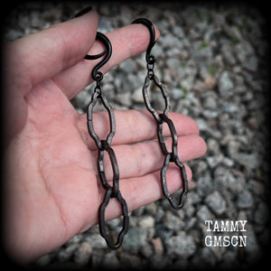 These gorgeous gothic ear hangers feature beautiful rustic antique bronze florentine style chain links, measuring approx 11cms from tip to tip, and weighing approx 10 grams each.

This pair has been made on 6 gauge (4mm) surgical steel full curls, to be worn in stretched lobes.
