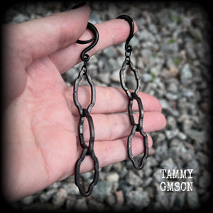 These gorgeous gothic ear hangers feature beautiful rustic antique bronze florentine style chain links, measuring approx 11cms from tip to tip, and weighing approx 10 grams each.

This pair has been made on 6 gauge (4mm) surgical steel full curls, to be worn in stretched lobes.