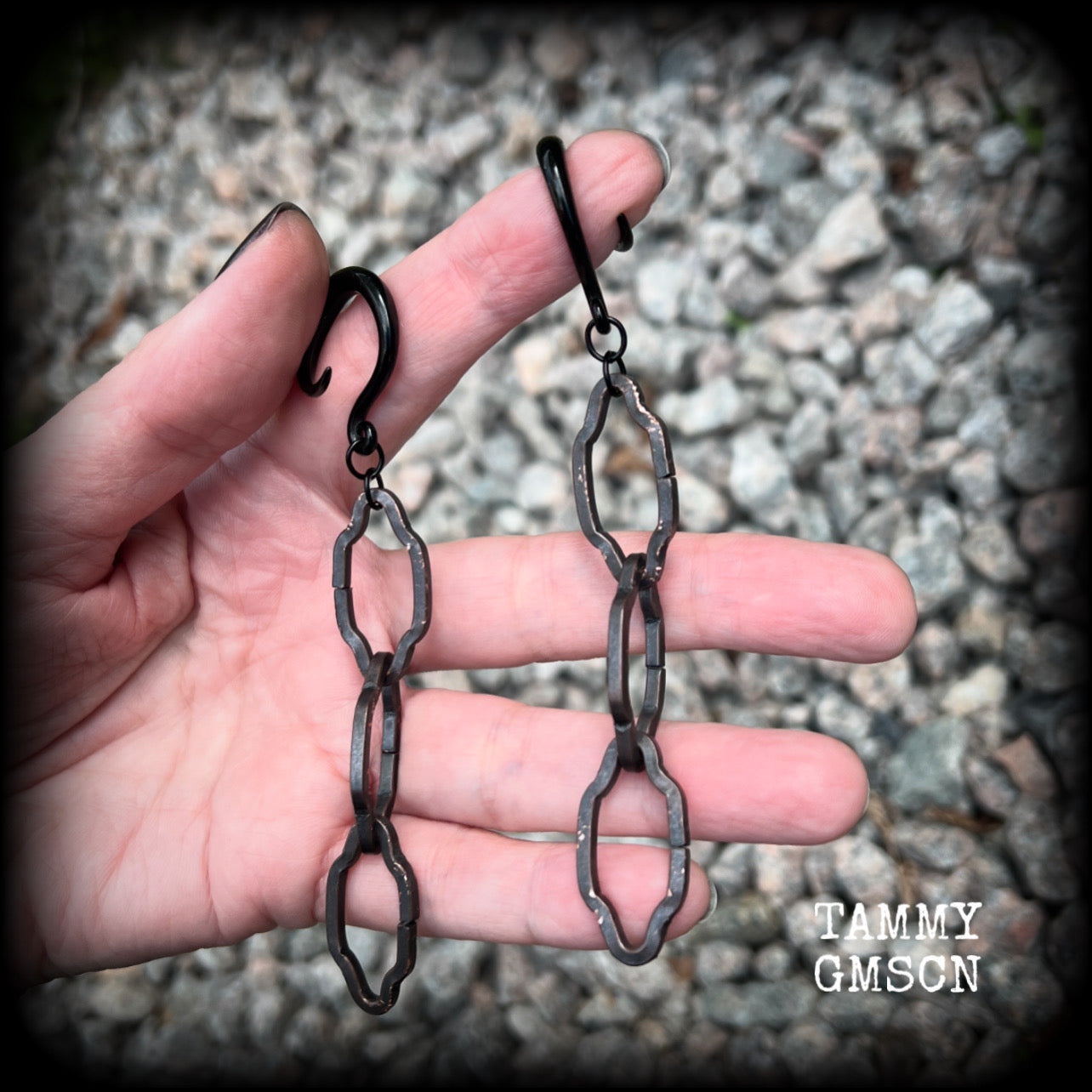 These gorgeous gothic ear hangers feature beautiful rustic antique bronze florentine style chain links, measuring approx 11cms from tip to tip, and weighing approx 10 grams each.

This pair has been made on 6 gauge (4mm) surgical steel full curls, to be worn in stretched lobes.