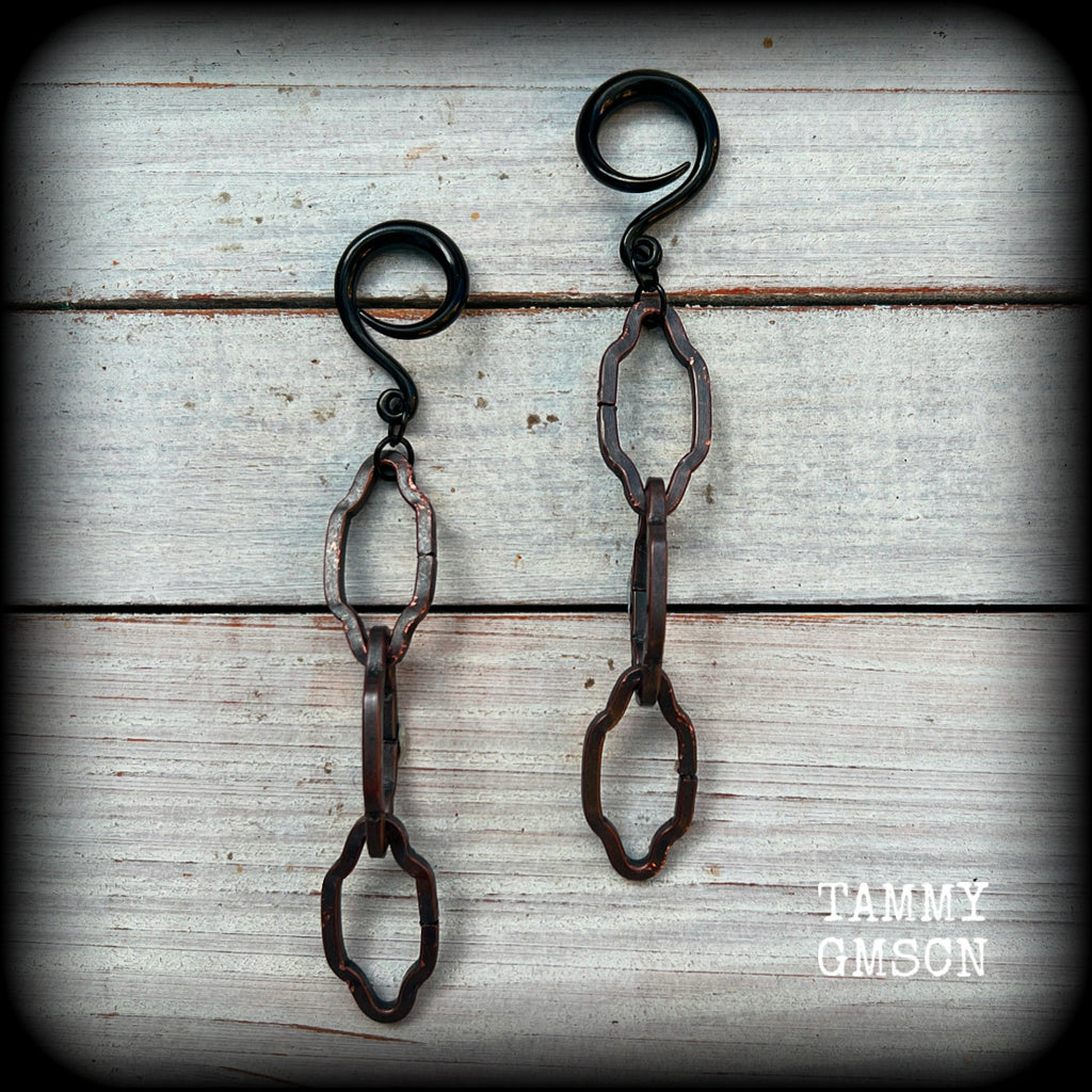 These gorgeous gothic ear hangers feature beautiful rustic antique bronze florentine style chain links, measuring approx 11cms from tip to tip, and weighing approx 10 grams each.

This pair has been made on 6 gauge (4mm) surgical steel full curls, to be worn in stretched lobes.