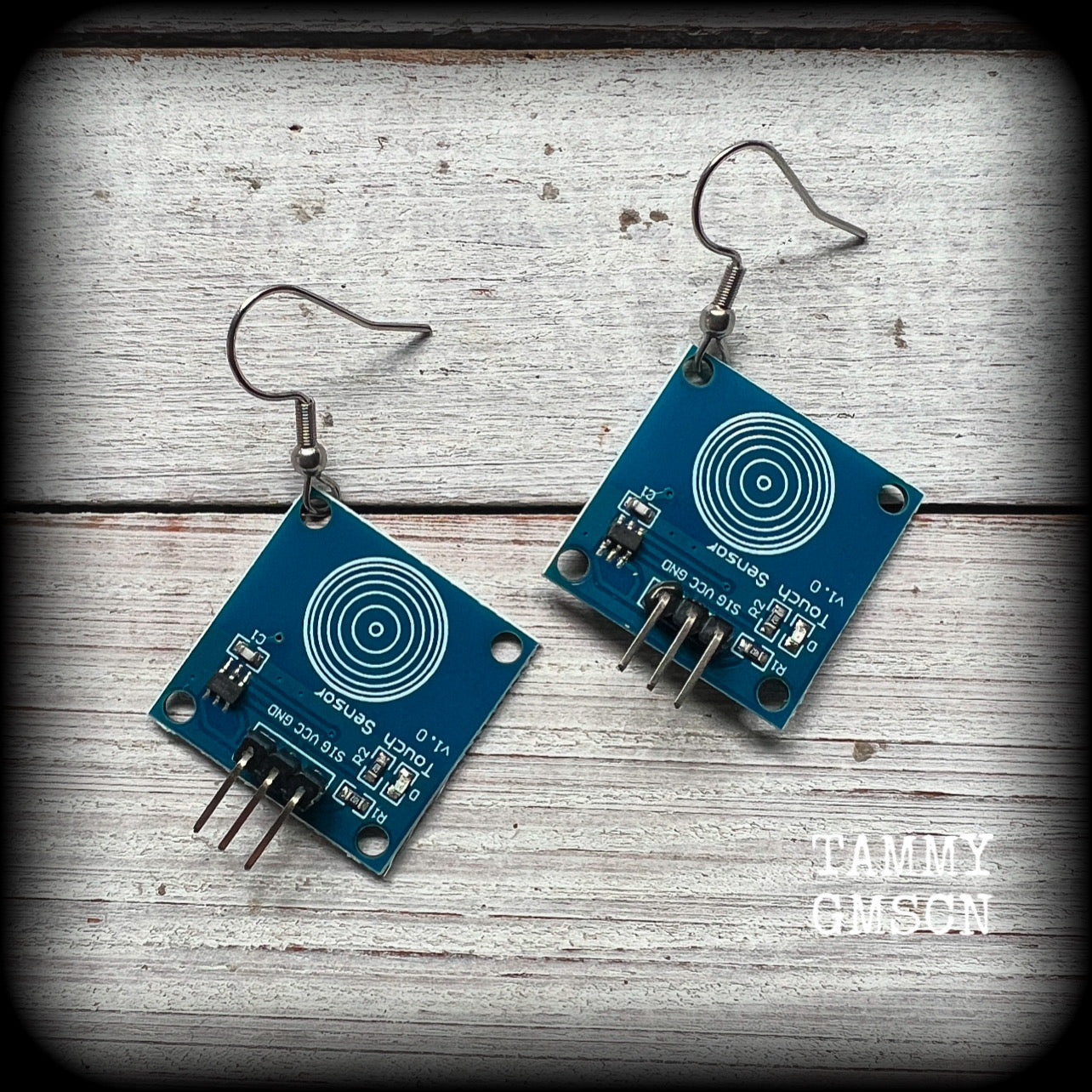 These awesome cyberpunk circuit board earrings measure just under 5 cms from tip to tip, and weigh only a few grams each, these are lovely and lightweight and not too dangly.
This pair has been made on stainless steel french hooks.