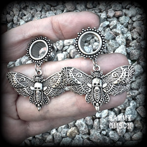 These gorgeous tunnel dangles feature antique silver deathshead moth charms, are not too heavy, weighing in at 9 grams each and measure just over 4.5cms from tip to tip.

This pair have been made with 1/2” gauge (12mm) surgical steel screw fit ornate tunnels.