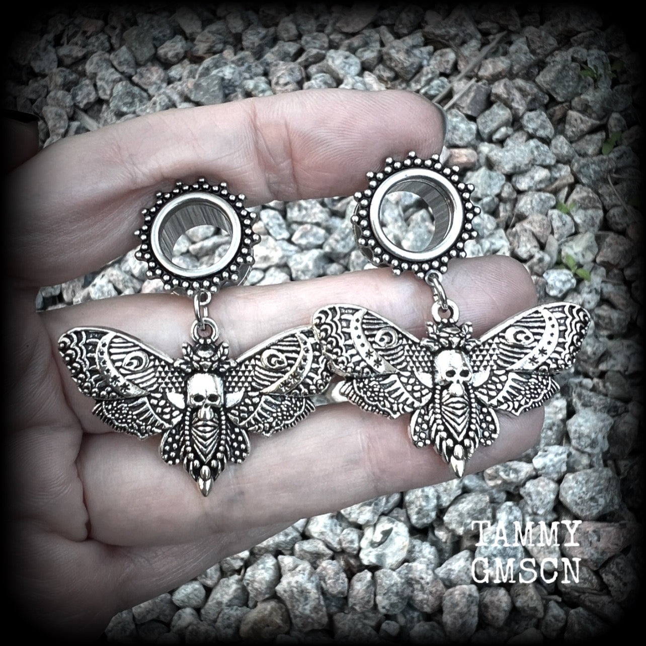 These gorgeous tunnel dangles feature antique silver deathshead moth charms, are not too heavy, weighing in at 9 grams each and measure just over 4.5cms from tip to tip.

This pair have been made with 1/2” gauge (12mm) surgical steel screw fit ornate tunnels.