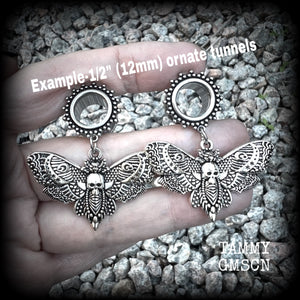 These gorgeous tunnel dangles feature antique silver deathshead moth charms, are not too heavy, weighing in at 9 grams each and measure just over 4.5cms from tip to tip.

This pair have been made with 1/2” gauge (12mm) surgical steel screw fit ornate tunnels.