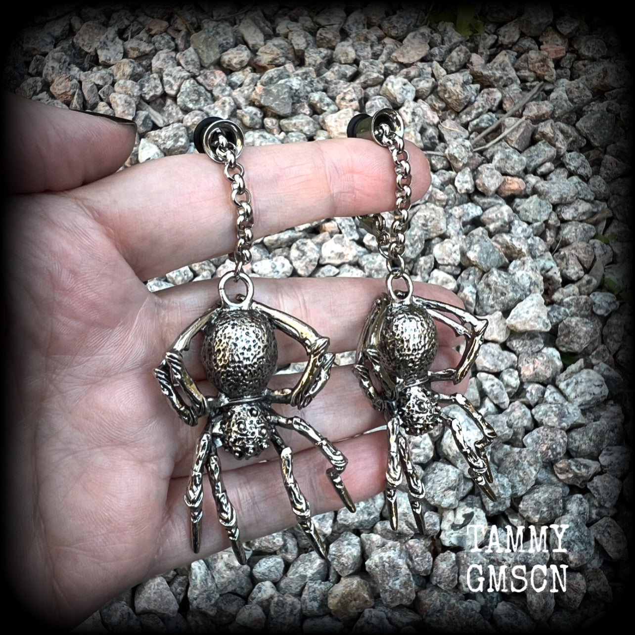 These big beautiful antique silver spider tunnel dangles are not too heavy and nice and dangly, weighing approx 18 grams each, and measuring just on 9cms from tip to tip.

🕷️ PLEASE NOTE-This particular chain will not filter through tunnels smaller than 2 gauge (6mm), though I have lots of different chains that will. Get in touch and we can pick something just for you x

💥This listing includes one pair of surgical steel single flared O-ring earlets.