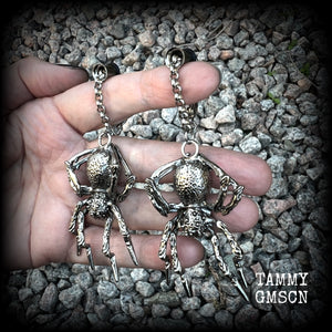 These big beautiful antique silver spider tunnel dangles are not too heavy and nice and dangly, weighing approx 18 grams each, and measuring just on 9cms from tip to tip.

🕷️ PLEASE NOTE-This particular chain will not filter through tunnels smaller than 2 gauge (6mm), though I have lots of different chains that will. Get in touch and we can pick something just for you x

💥This listing includes one pair of surgical steel single flared O-ring earlets.