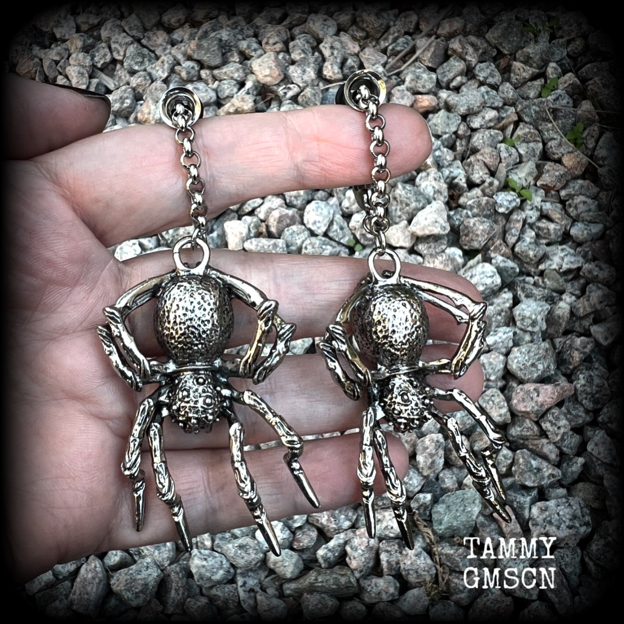 These big beautiful antique silver spider tunnel dangles are not too heavy and nice and dangly, weighing approx 18 grams each, and measuring just on 9cms from tip to tip.

🕷️ PLEASE NOTE-This particular chain will not filter through tunnels smaller than 2 gauge (6mm), though I have lots of different chains that will. Get in touch and we can pick something just for you x

💥This listing includes one pair of surgical steel single flared O-ring earlets.