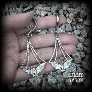 Featuring gorgeous light weight gothic silver bat charms, these spooky cute gauged earrings weigh in at 7 grams a piece, and measure just over 7cms from tip to tip.

This pair has been made on 6 gauge (4mm) surgical steel full curl hooks, to be worn in stretched lobes.