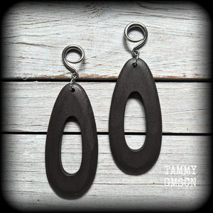 These beautiful carved wood teardop gauged earrings are night and lightweight, weighing in at only 9 grams a piece, and lively and dangly, measuring just on 12cms from tip to tip.
This pair has been made on 6 gauge (4mm) surgical steel full curl hooks, suitable for stretched lobes.