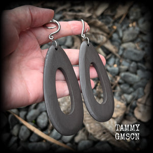 These beautiful carved wood teardop gauged earrings are night and lightweight, weighing in at only 9 grams a piece, and lively and dangly, measuring just on 12cms from tip to tip.
This pair has been made on 6 gauge (4mm) surgical steel full curl hooks, suitable for stretched lobes.