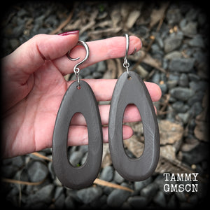 These beautiful carved wood teardop gauged earrings are night and lightweight, weighing in at only 9 grams a piece, and lively and dangly, measuring just on 12cms from tip to tip.
This pair has been made on 6 gauge (4mm) surgical steel full curl hooks, suitable for stretched lobes.