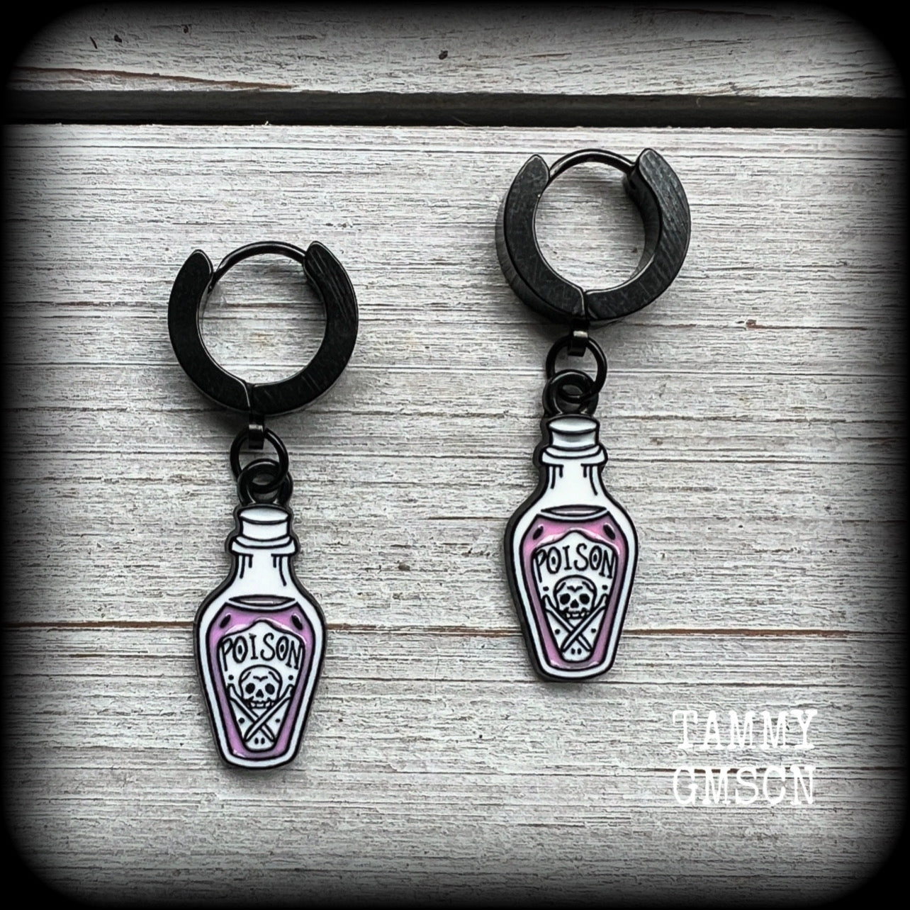 Poison bottle huggie earrings-Pastel goth earrings