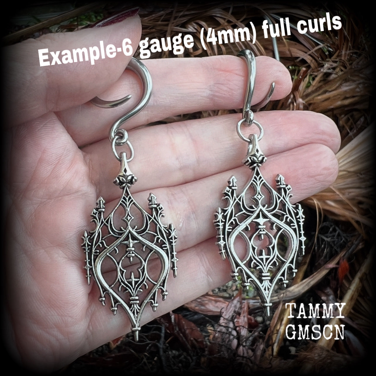 These gorgeous gothic ear hangers feature a beautiful antique silver ornate gothic cathedral chandelier, measuring just on 8cms from tip to tip, and weighing approx 10 grams each. This pair has been made on 6 gauge (4mm) surgical steel full curls.